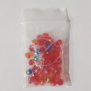 One Small Bag of Mixed Light Colored Glass Beads and Thread